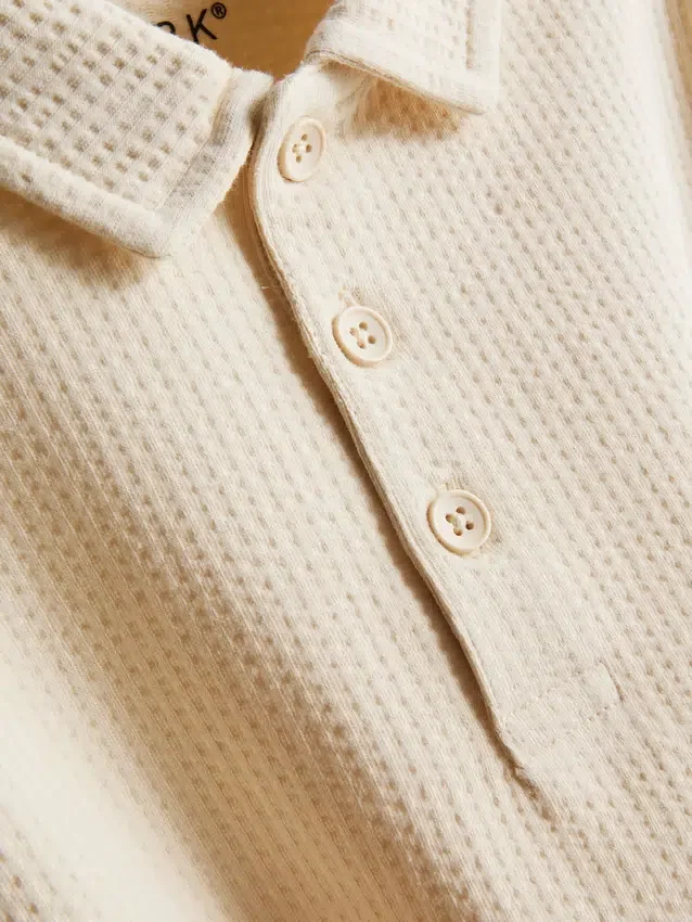 1-9 jaar | set bestaande uit een poloshirt met textuur en een korte broek