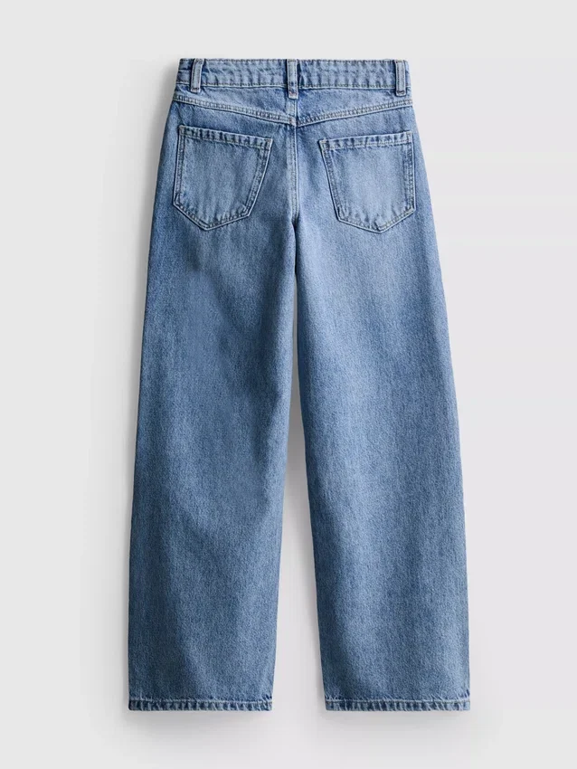 7-15 jaar | Jeans met wijde pijpen en geborduurde bloemenstrik