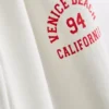 7-15 jaar | Joggingbroek met grafische print en wijde pijpen ‘Venice City’