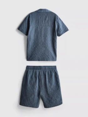 7-15 jaar | set bestaande uit een gestructureerd overhemd met korte mouwen en knopen en een korte broek