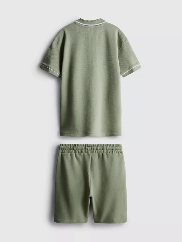 7-15 jaar | set van een poloshirt met textuur en een korte broek