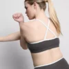 Actieve crop top met contrasterende rand en gekruiste rug