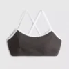 Actieve crop top met contrasterende rand en gekruiste rug