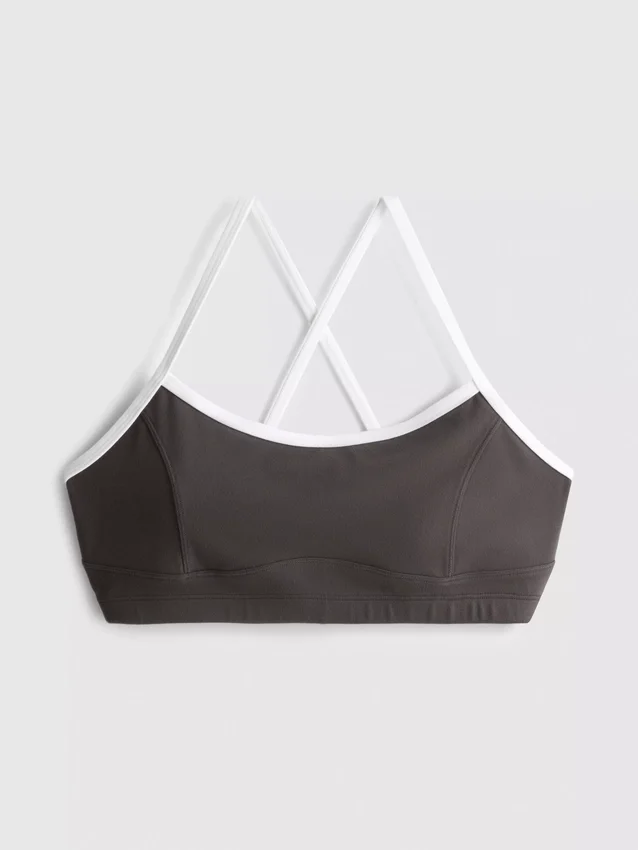 Actieve crop top met contrasterende rand en gekruiste rug