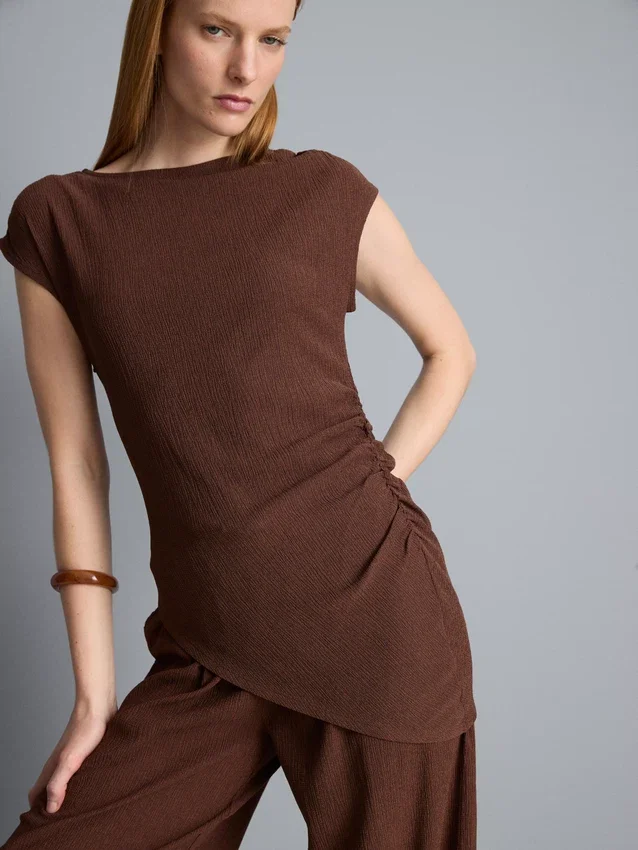 Asymmetrische gekreukelde top