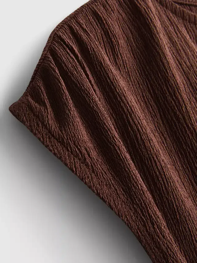 Asymmetrische gekreukelde top
