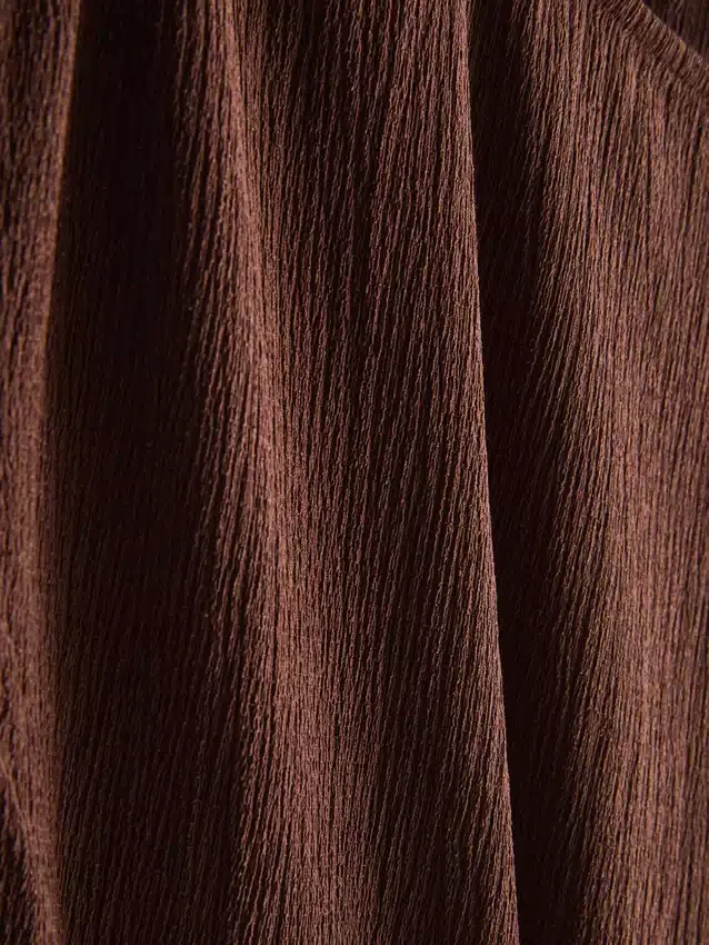 Asymmetrische gekreukelde top