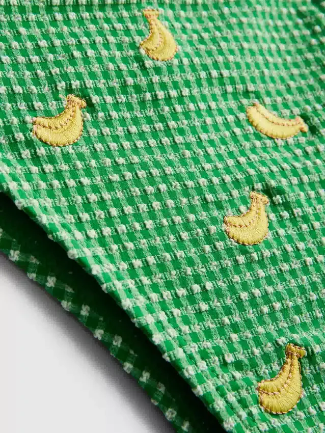 Bikinibroekje met bananenprint en strikjes aan de zijkant