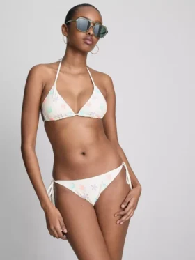 Bikinibroekje met borduursel en strik aan de zijkant