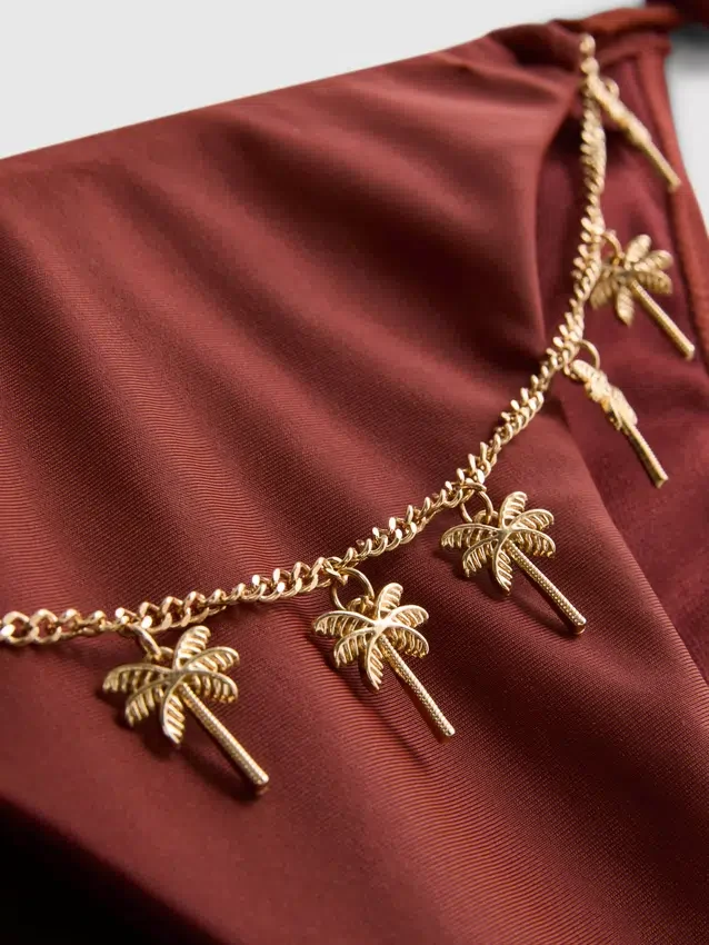 Bikinibroekje met kettingdetail en strik aan de zijkant