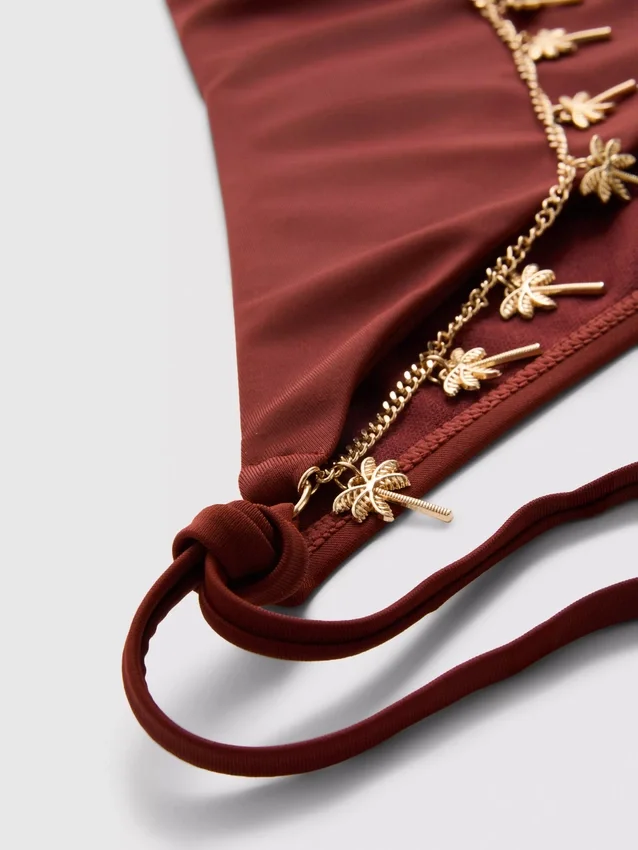Bikinibroekje met kettingdetail en strik aan de zijkant