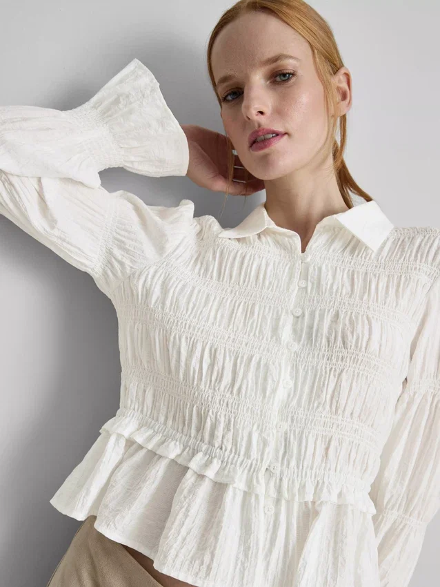 Blouse met gerimpelde peplumzoom