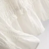 Blouse met gerimpelde peplumzoom