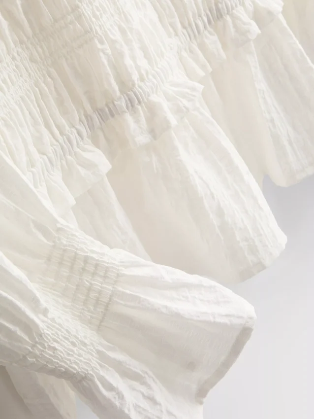 Blouse met gerimpelde peplumzoom