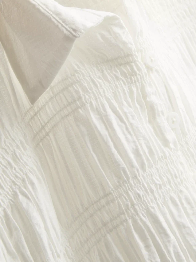 Blouse met gerimpelde peplumzoom