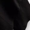 Broek met gekreukelde stof en wijde pijpen