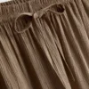 Broek met gekreukelde stof en wijde pijpen