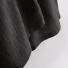 Broek met gekreukelde stof en wijde pijpen