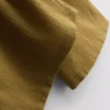 Broek met gekreukelde stof en wijde pijpen