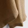 Broek met gekreukelde stof en wijde pijpen