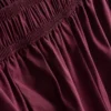 Broek met plooien en wijd uitlopende pijpen met papierachtige textuur