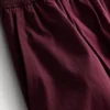 Broek met plooien en wijd uitlopende pijpen met papierachtige textuur