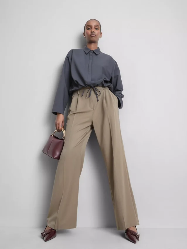 Broek met plooien en wijde pijpen