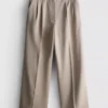 Broek met plooien en wijde pijpen