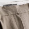 Broek met plooien en wijde pijpen