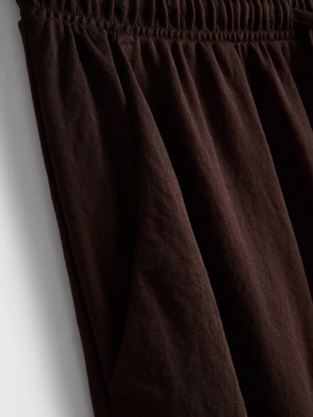 Broek met textuur en wijde pijpen