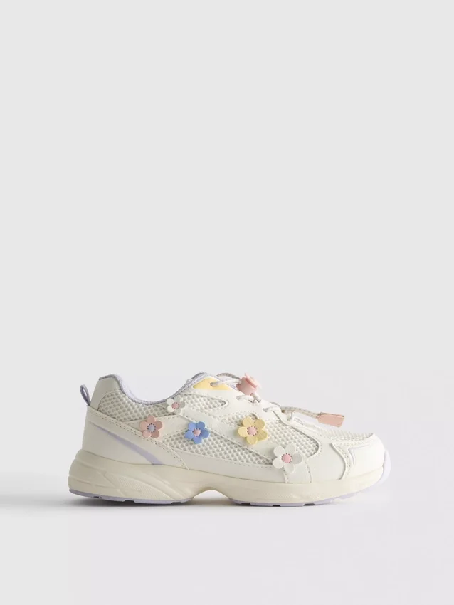 Chunky sneakers met bloemendetails