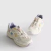 Chunky sneakers met bloemendetails