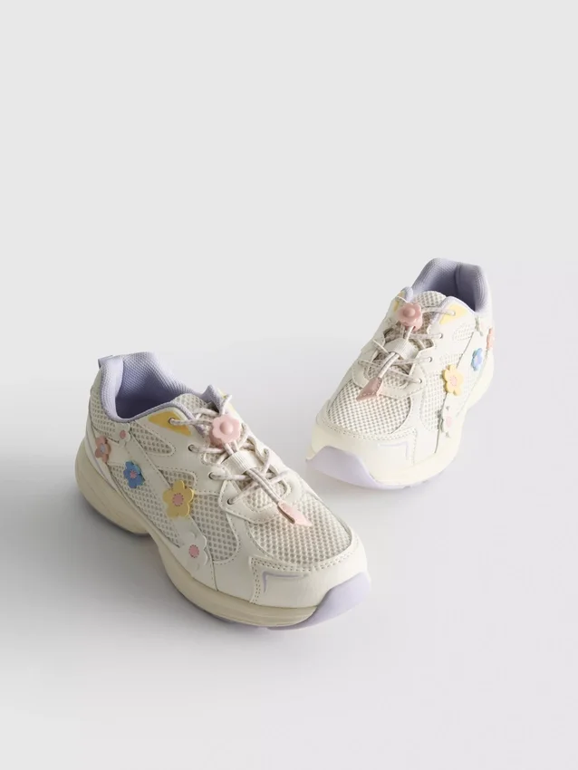 Chunky sneakers met bloemendetails