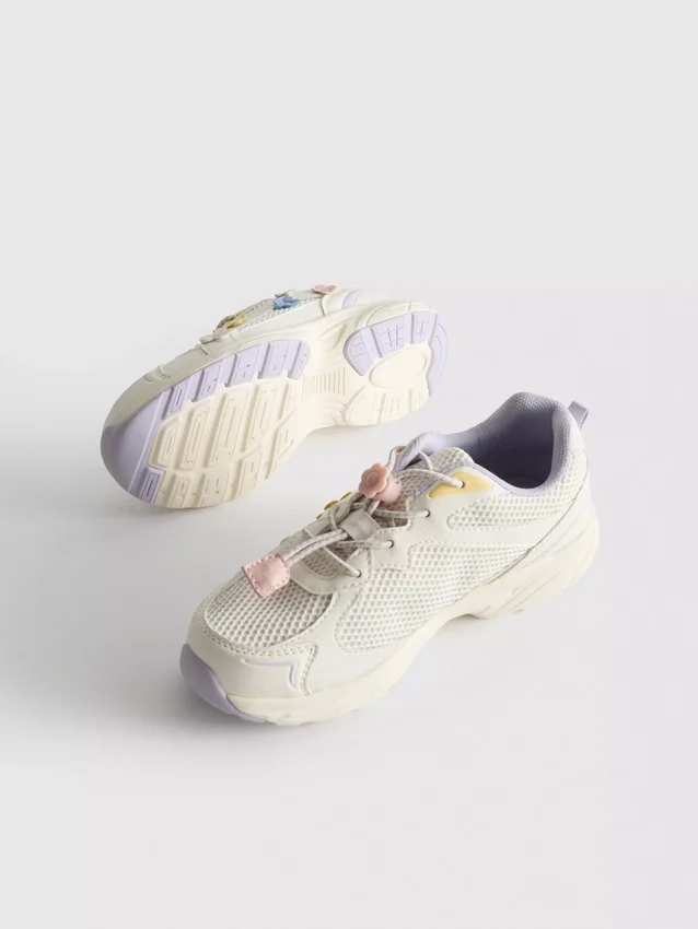 Chunky sneakers met bloemendetails