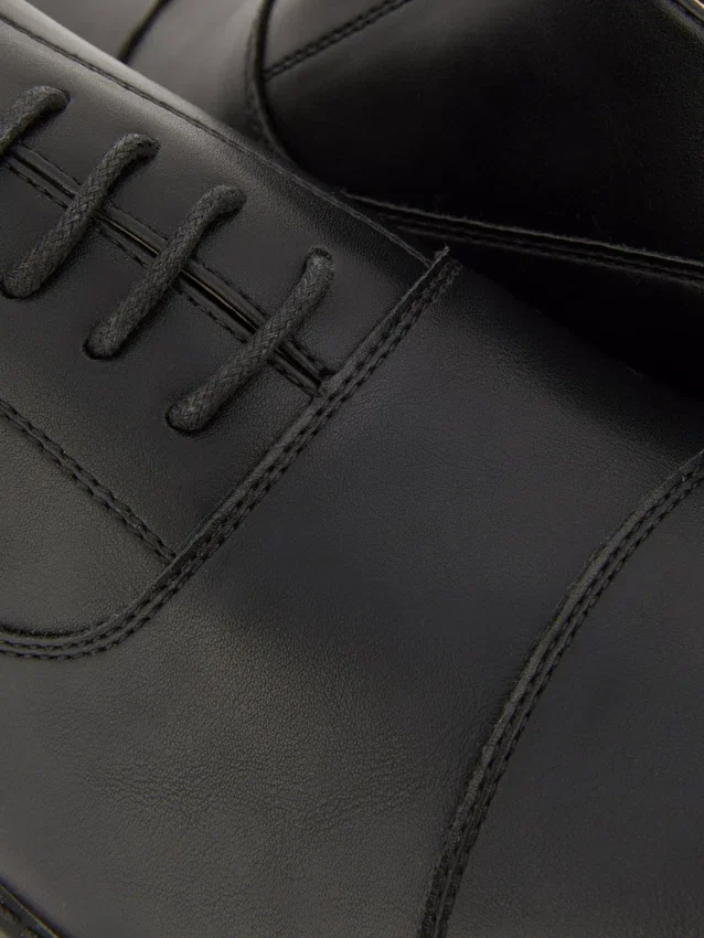 Formele loafers met vetersluiting