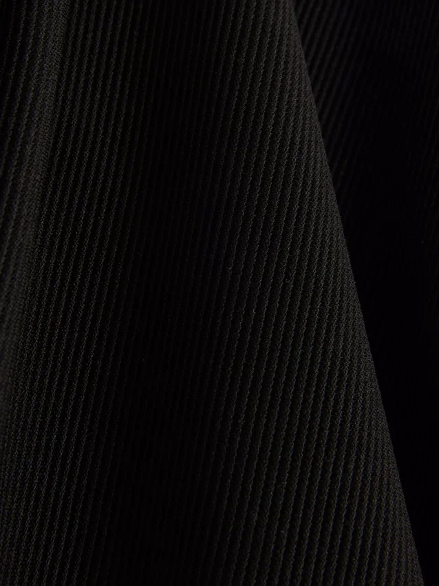 Geribde broek met uitlopende pijpen