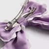 Haarspeld met strik en geschulpte rand