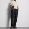 Het gebreide poloshirt van The Edit