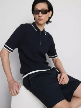Het The Edit-poloshirt met rits en textuur