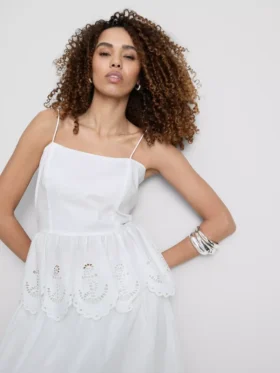 Katoenen cami-top met geborduurde peplumzoom
