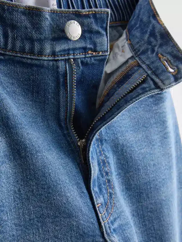 Katoenen denim jeans met hoge taille en taps toelopende pijpen