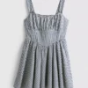 Mini-jurk met korset in gingham-motief