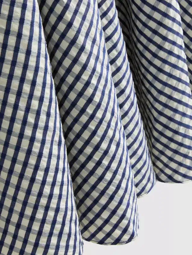 Mini-jurk met korset in gingham-motief