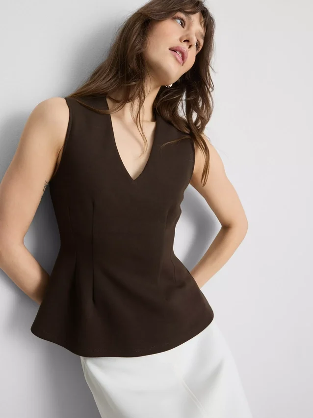 Mouwloze top met V-hals en peplum