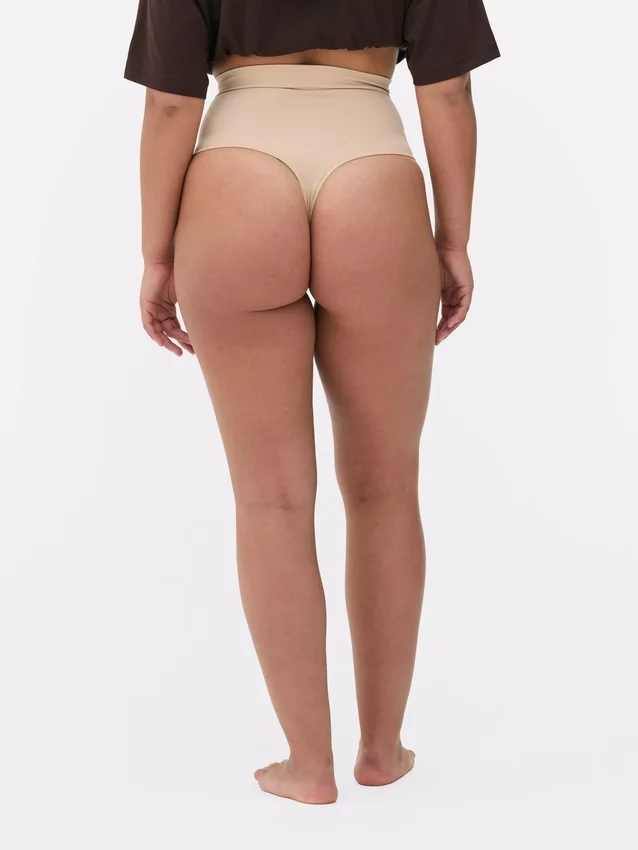 Naadloze, figuurcorrigerende string met hoge taille