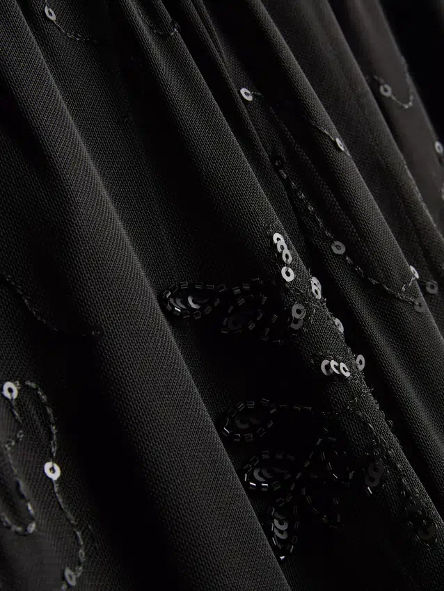 Paula Echevarría broek met kralen en mesh, wijde pijpen