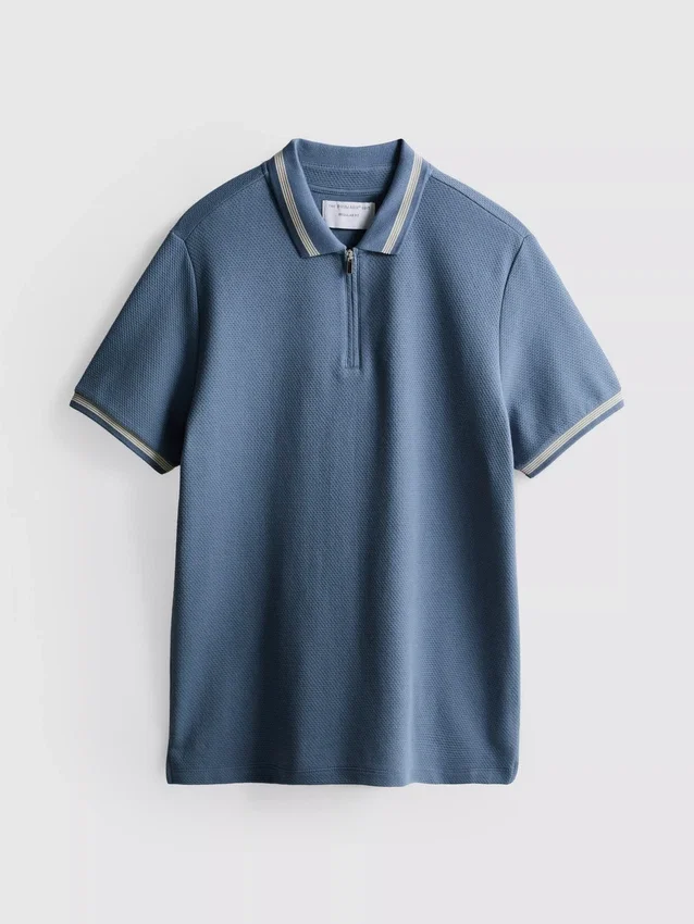 Polo met ritssluiting en structuur