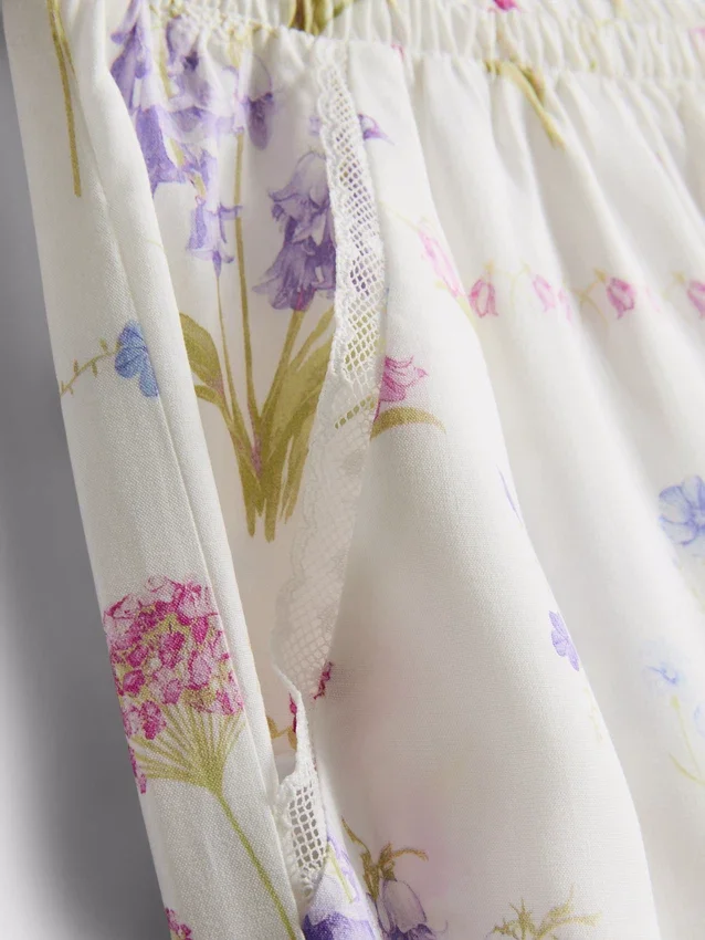 Pyjamabroek met bloemenprint en wijde pijpen