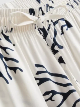 Pyjamabroek met wijde pijpen en koraalprint