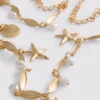 Riem met schelpenhanger en ketting